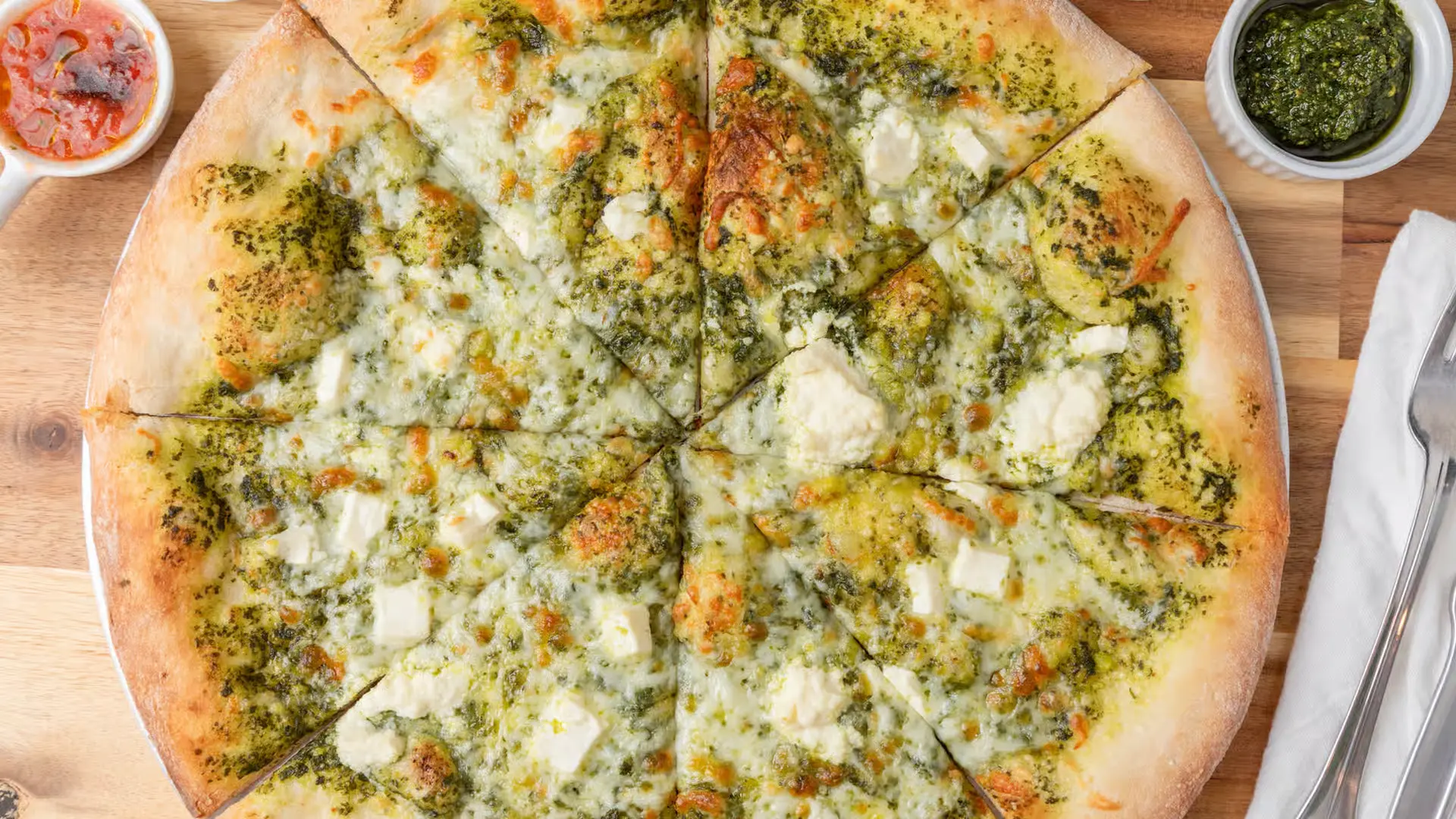 Green Pizza signature four cheese pesto pizza in Calgary